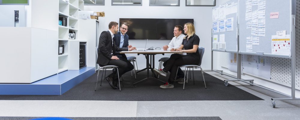 Corporate meeting in architecture firm conference room